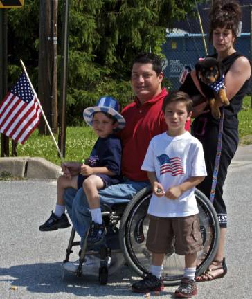 Scenes from Memorial Day in Vernon The Catania Family including Mark, 3, Anthony, 5, with Dad, Mom and Spike, wait to see the other family member Mathew, march with Cub Scout Troop 404, Den 8.