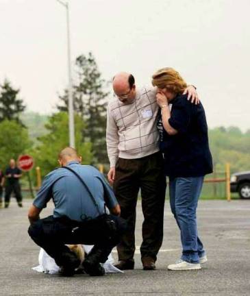 Rachel Rome's parents mourn as they identify her 'lifeless' body at the scene of the staged crash on.