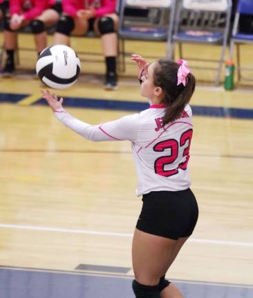Jefferson wins Dig Pink volleyball match Jefferson's Kayla Scherlacher about to serve the ball.