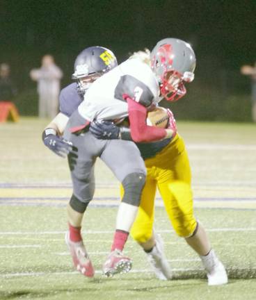 High Point ball carrier Connor Lake is grabbed by Jefferson defender Richie Raymond in the second half