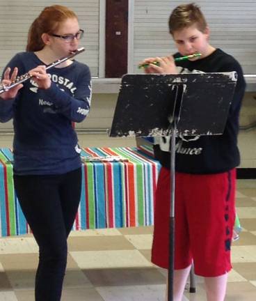 Middle School students celebrate Colonial Day Lauren Kapplemeier and Nick Whitehead are shown on flutes.