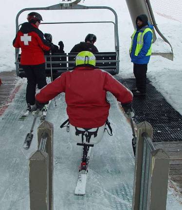Adaptive ski committee tests Mountain Creek lifts The plan to enter the sugar chair lift is tested by the PSIA adaptive instructor and Susanne Ebling.