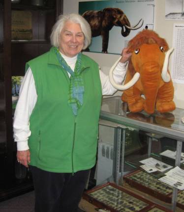 Member Judy Storms poses with Vernon&#xfe;&#xc4;&#xf4;s famous mastodon Matilda at the historical society&#xfe;&#xc4;&#xf4;s Route 94 headquarters.