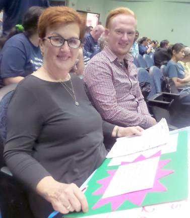 Retired teacher Kerry Williams (left) and her son Mira Williams, who spoke before the school board against mask wearing (Photo by Frances Ruth Harris)