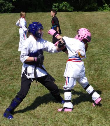 Students of Vernon Valley Karate Academy are shown sparring.