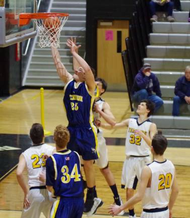 Vernon's Jeff Sedlock leaps high for a shot.