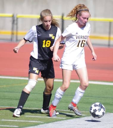 Vernon's Catherine McCabe is shadowed by West Milford's Kristen Graf.