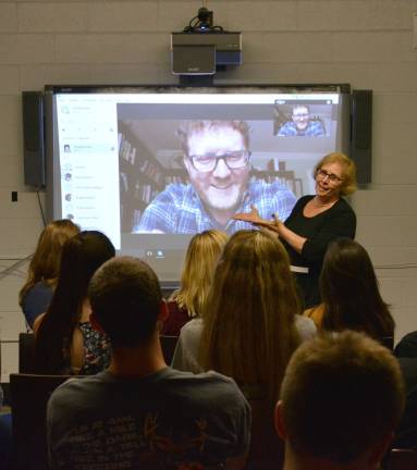 VTHS English students talk to bestselling author Mrs, Longchamp facilitates the conversation between her sophomore English class and author Brendan Kiely via Skpe.d