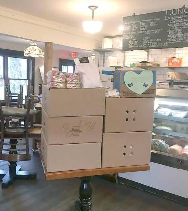 'We have lots of muscle and lots of food': Stillwater volunteers deliver the goods Meals at Garris General Store, in Stillwater, ready for delivery to healthcare workers on the front lines.