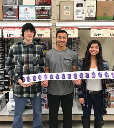 Local sticker shock events engage youth in underage drinking prevention Max, John and Alex at Franklin ShopRite.