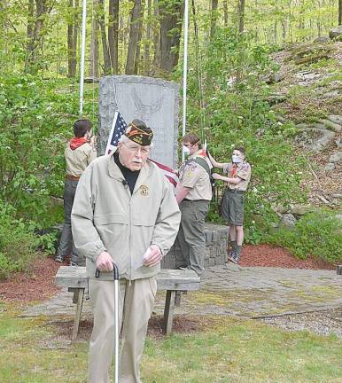Former Mayor Richard Bowe concludes remarks as Boy Scouts from Troop 276 prepare to raise the colors. (Photo provided)