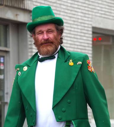 Wearing green is one very tall and oversized leprechaun Mike Donahue of Stanhope. He was born in County Cork in Ireland.