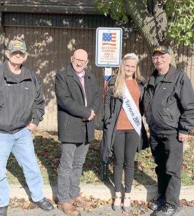 From left, Vietnam veteran Owen Martin, Vernon Township Mayor Harry Shortway, Hannah Van Blarcom and Vietnam veteran John Harrigan. stand in front of one of the new veteran Parking Only signs.