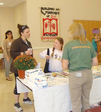 Learning about health Visitors listen to healthy tips at the Sussex County School Nurses table