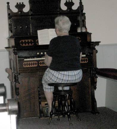 Old Clove Church celebrates 189 years Marilyn Slate practices hymns for the annual service at the church.