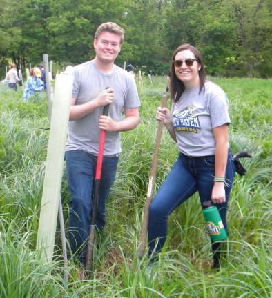 High Point class collaborates in tree planting High Point students Aidan Becker (left) and Ally Fairweather (right).