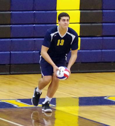 Jefferson's Tarik Shoukry in the midst of a serve. Shoukry contributed 8 kills, 4 blocks and 7 digs.