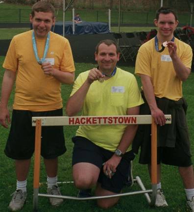 Showing off their medals between races&#xa0;at the Area 3 Special Olympics Track and Field Meet are, from left, Special Olympics athletes Aaron Bono of Wantage, Lenny Syfor of Hardyston, and Andrew Hertel of Sparta.