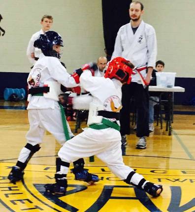Vernon Valley Karate hosts Winterfest Ryan Rieger and Emma Franetovic compete in a sparring match.