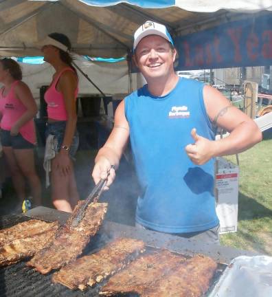 The Rock, Ribs & Ridges Festival returns The pitmaster grilling ribs (Photo by Russ Mensch)