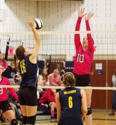 Jefferson wins Dig Pink volleyball match Vernon's Katie Owens (26) and Jefferson's Julia Murawinski (10) rise for the ball.