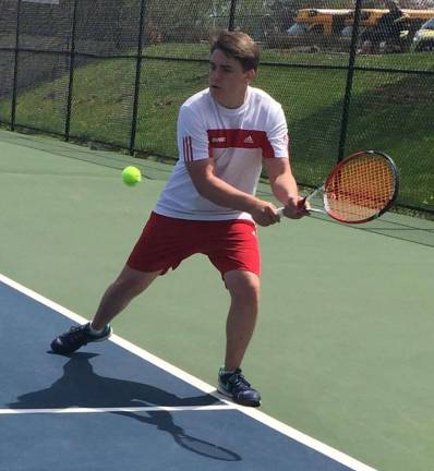 Spencer Arnold hits a backhand at the Hunterdon-Sussex-Warren Tournament on April 19.