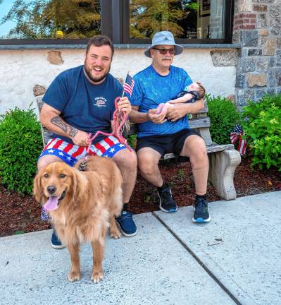 Sparta. Fourth of July events Conor, Cara and Mike Chirico with their dog Mika.