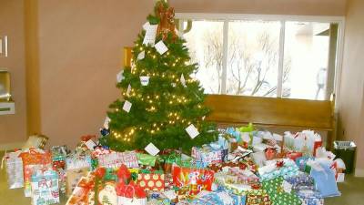 The Giving Tree at St. Francis de Sales Church beautifully displays the donation of gifts to area families in need.