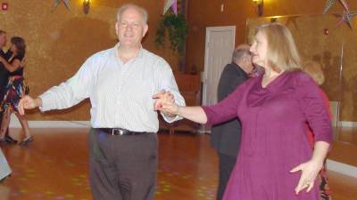 Out front, ballroom owners Russ and Katy Fischer strut their moves