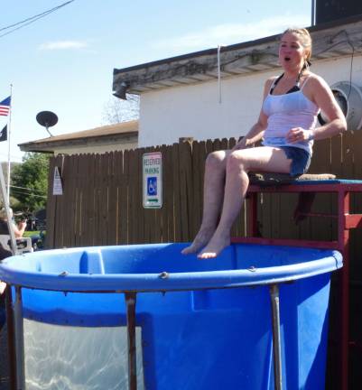 Elks organizer Patty Green egged on those who wanted to once again deposit her in the dunk tank.