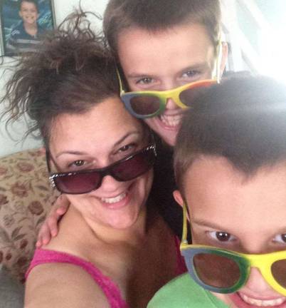 Local author describes 'Ups and Downs of Raising Four Boys' Highland Lakes author Gerri Russo is shown with two of her sons.