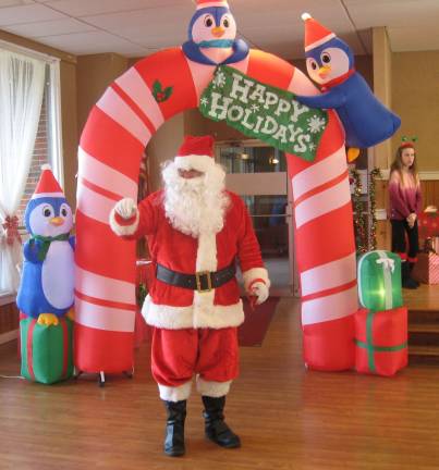 Santa, the guest of honor, arrives at the party.