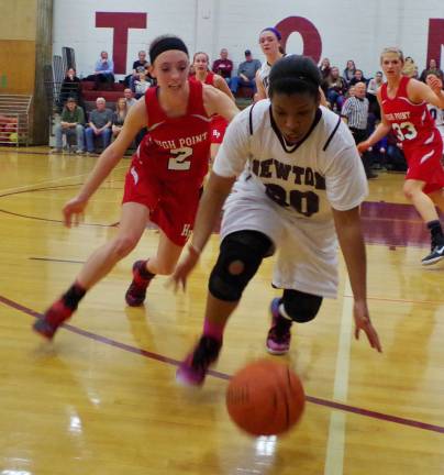 High Point's Kayla Smith and Newton's Kayla Chambliss go after a loose ball.