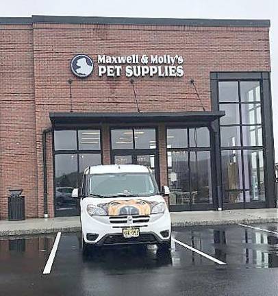 Maxwell & Molly’s Closet Pet Boutique ready to open in Sparta The Maxwell & Molly’s van sits in front of the new store. The van has seen a lot of action during the pandemic delivering pet supplies (Photo by Laurie Gordon)