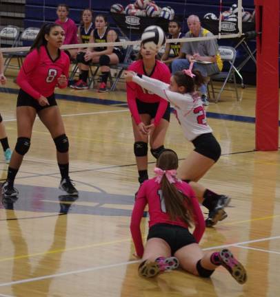 Jefferson wins Dig Pink volleyball match Jefferson's Kayla Scherlacher (white) strikes the ball.