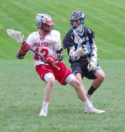 High Point falls to Parsippany Hills High Point's Ryan Matthews maneuvers the ball as Parsippany Hills' Angelo Varcadipane defends.