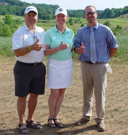 Crystal Springs&#xfe;&#xc4;&#xf4; Tom Dyer gives a thumbs up to the Brews &amp; Birdies low gross winners: Joe and Maunia Vizanko