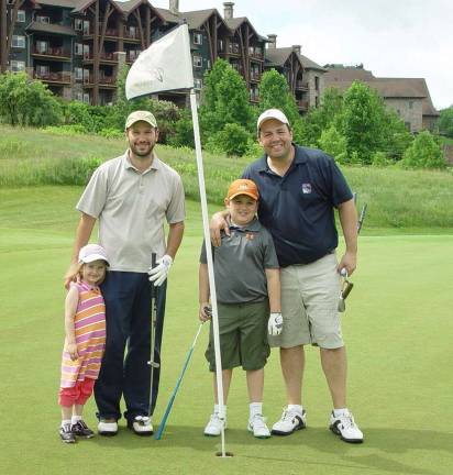 Crystal Springs hosts Father's Day golf Dan and K-4th grade winner Hazel Chernowsky and Lou and 3rd-place winner Nick Theodorou stop play for a photo.
