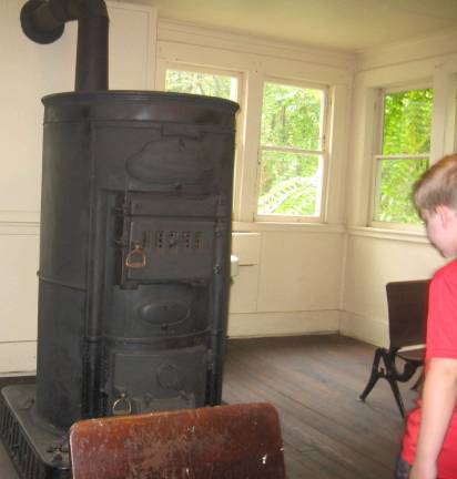 The original pot-belly stove served as the school&#x2019;s only heat source.