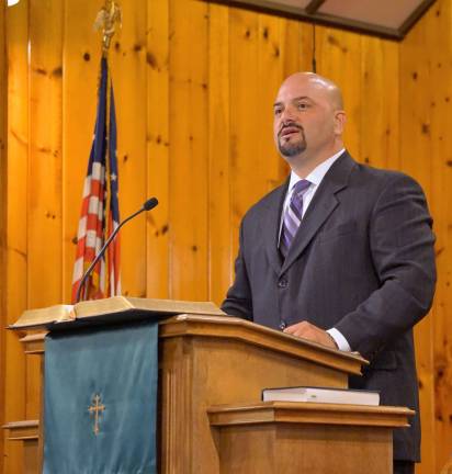 Pastor Michael Rojas preaches in Christ Community Church.