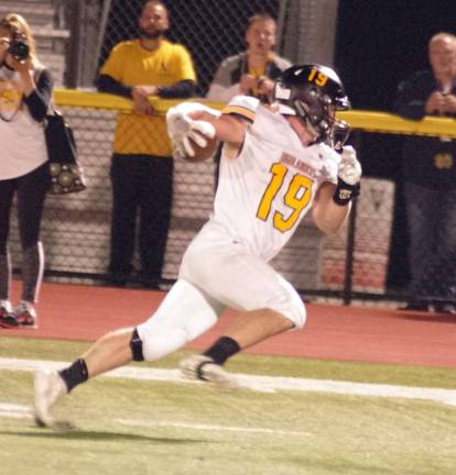After catching a 40 yard pass West Milford's Ryan Coyle moves swiftly with the ball eventually reaching the end zone for a touchdown in the first quarter.