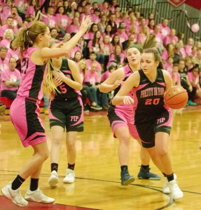 High Point wins Pretty in Pink classic High Point's Margo Peterson moves the ball on the court.