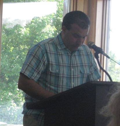 PHOTOS BY JANET REDYKEHighland Lakes resident Ron Berutti solemnly reads the Declaration of Independence on a beautiful July 4.