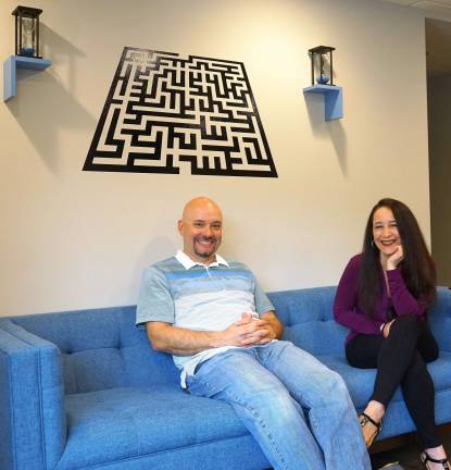 Solve It Escape Rooms opens in Vernon PHOTOS BY VERA OLINSKI From left, owners Charles and Edna Morales highlight fun features of Solve it...Escape Rooms.