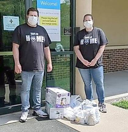 Sussex County Stars help the community through tough times Brother and sister team Karen and Rob Carney dropping off supplies at Project Self-Sufficiency, which assists low-income families (Photo provided)