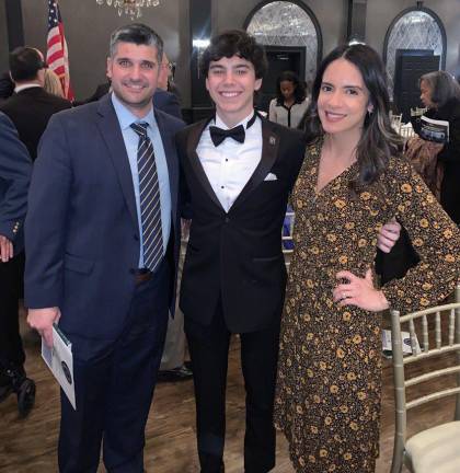 Senior Rick Healy is Vernon’s representative at the Greater Morris County Chapter Scholar-Athlete ceremony for football. Rick was a wide receiver on the football team and center fielder on the baseball team. At left is head football coach Steve Down and at right is Vernon Township High School Principal Lindsay Young. (Photo provided)