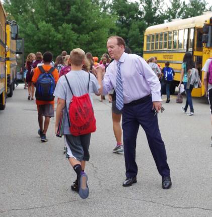 Dr. Charles McKay, Assistant Superintendent of the Vernon Township School District welcomed 7th and 8th grade students as they arrived from some 13 buses at the upper parking lot of Glen Meadow Middle School. He also welcomed the bus drivers and shared high fives with some of the students.