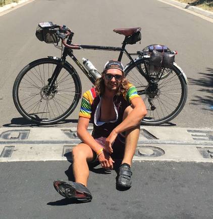Vernon residnet biking for MS awareness Jeff Brath sits on the border between Nevada and California.