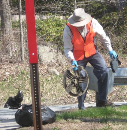 Highland Lakes resident Clark Beebe is a trash hero as he finds hubcaps, license plates and other litter discarded on lake community roads.