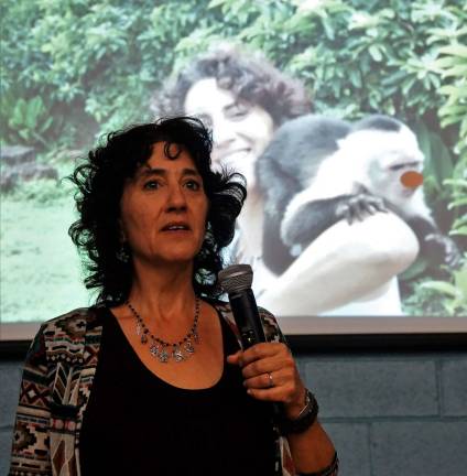 Author Rachelle Burk teaches students about writing when a monkey with a red clown nose appears.